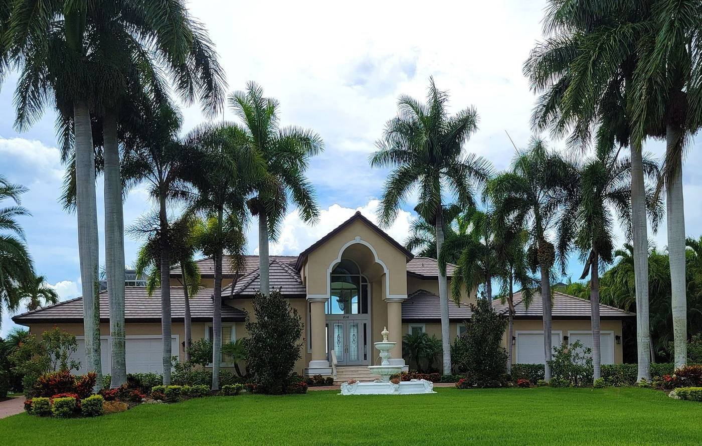 Palm-lined Florida estate entrance